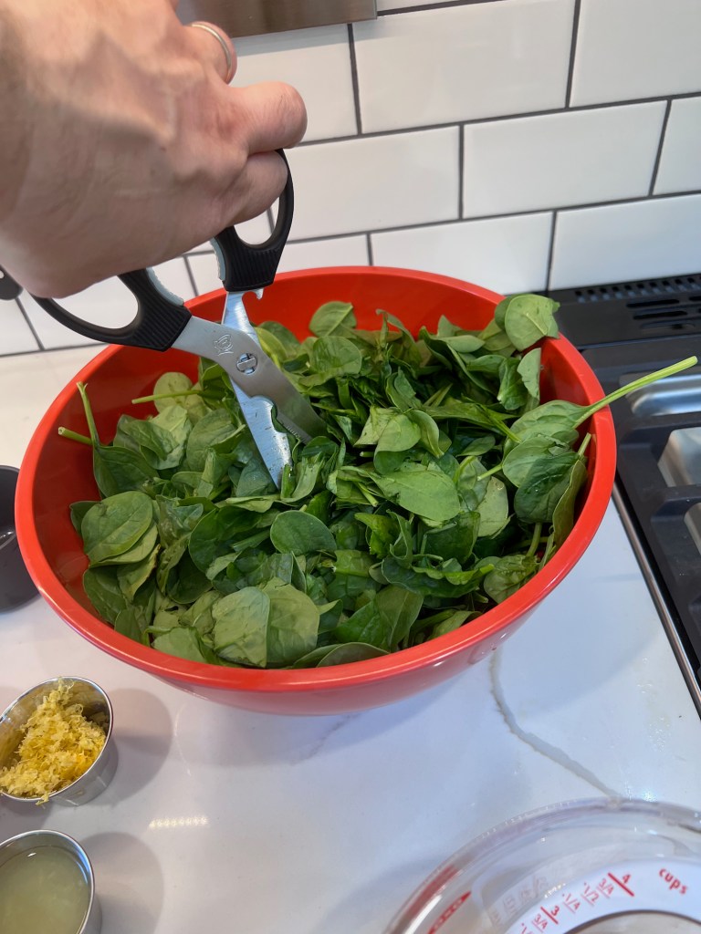 How to make spanakorizo.  Cut the spinach a bit