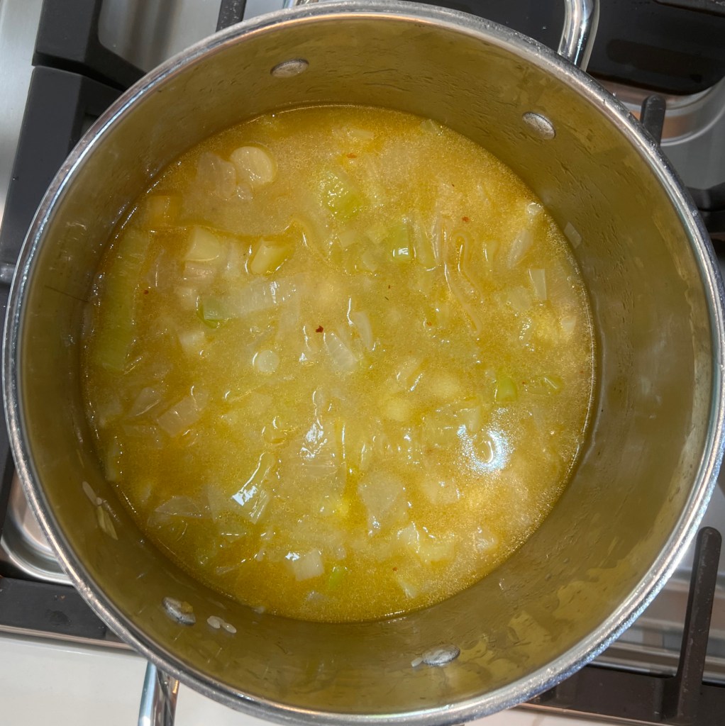 Add water and simmer for 25